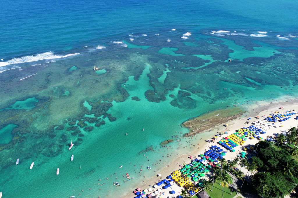 Aerial view Porto de Galinhas Beaches, Pernambuco, Brazil: unique experience of swimming in means to fish in natural pools. Fantastic vacation travel. Great beach scene. Beautiful landscape. Great travel destination.